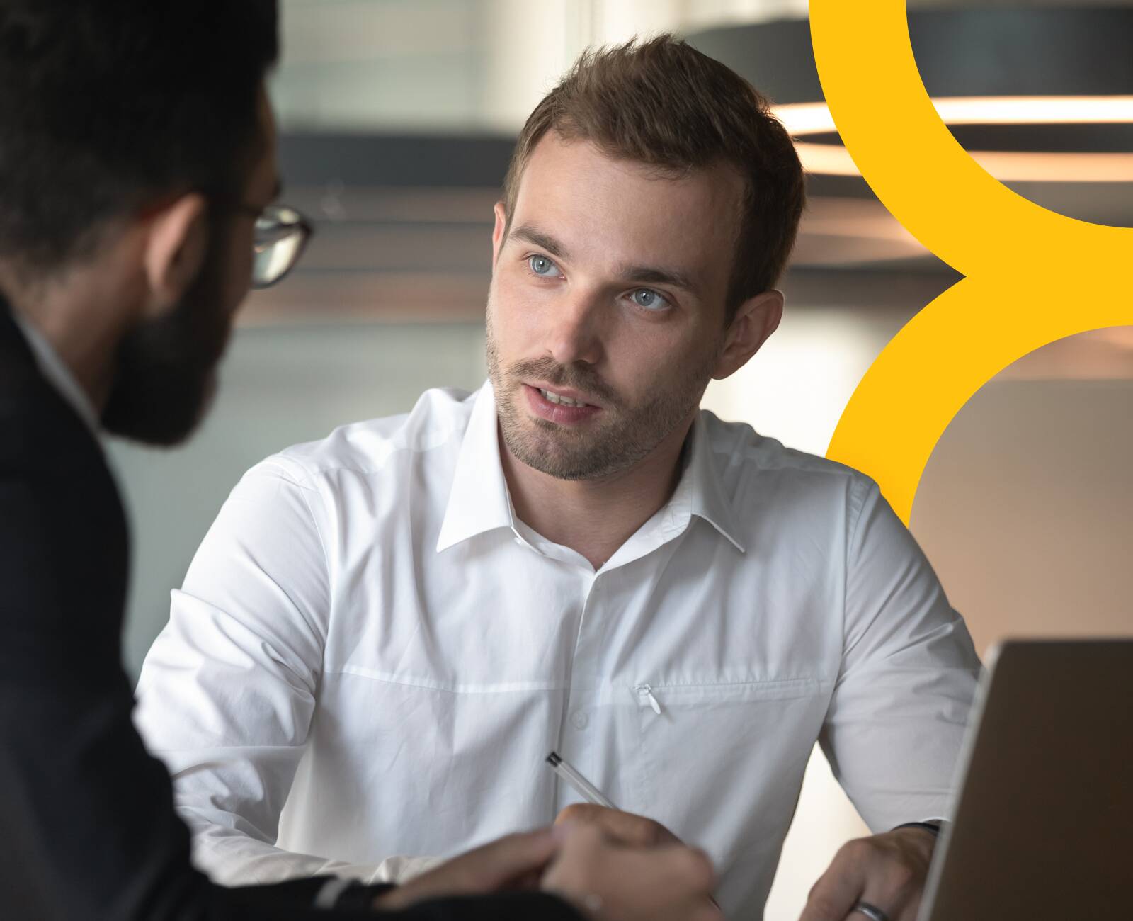 two team members having a conversation.