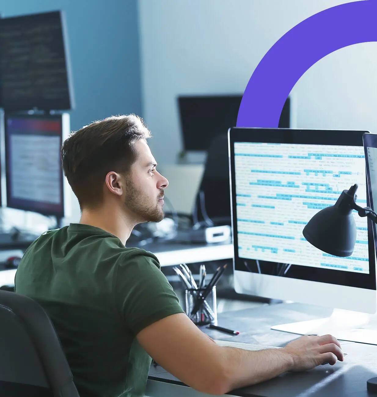 Developer working on code in front of a monitor.