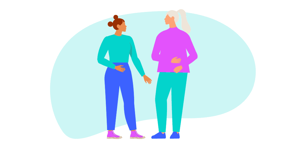 Two female co-workers are chatting.